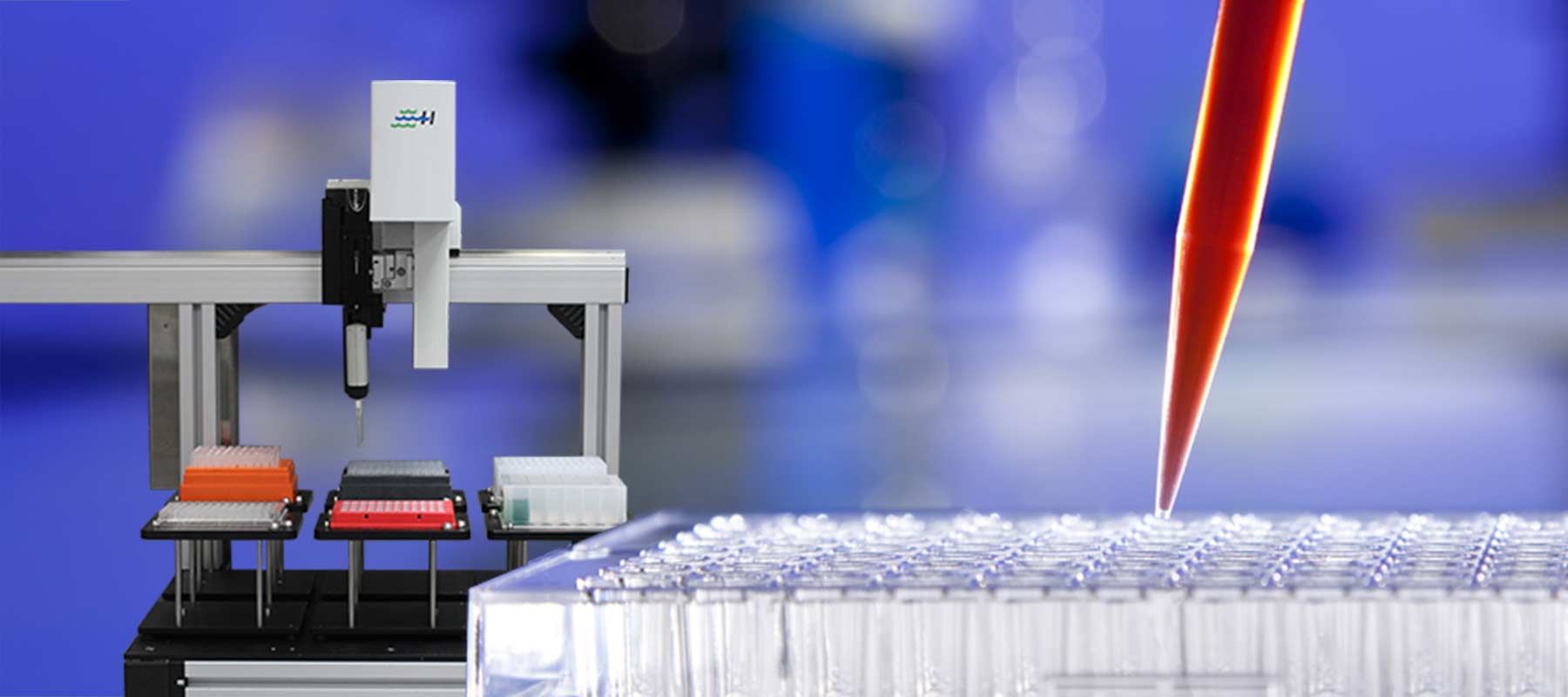 Hand pipetting with robot in background for article on liquid handling systems